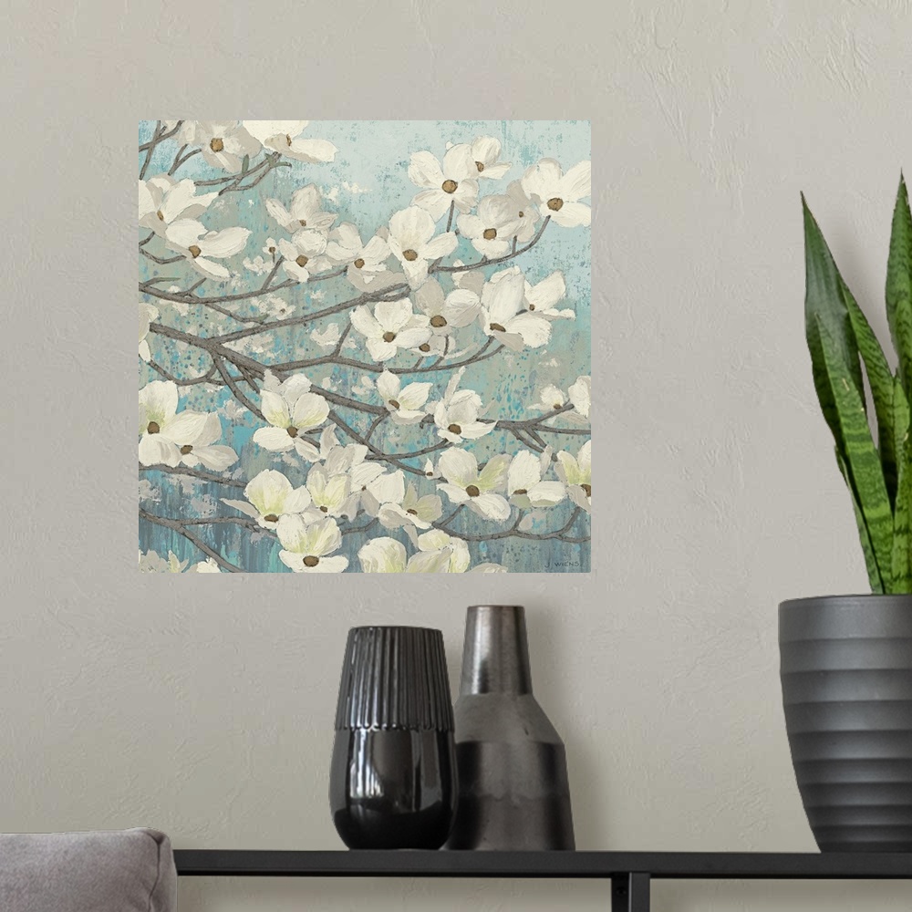 A modern room featuring Square painting of a group of small white flowers on thin branches on a light, textured background.