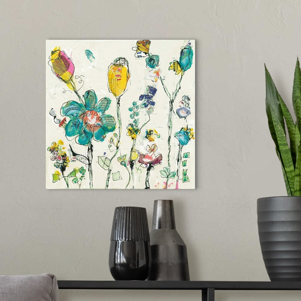 A modern room featuring Decorative artwork featuring illustrative flowers that are adorned with cut paper.