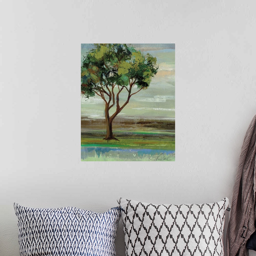 A bohemian room featuring Contemporary artwork of a tree with leafy green branches in a field.
