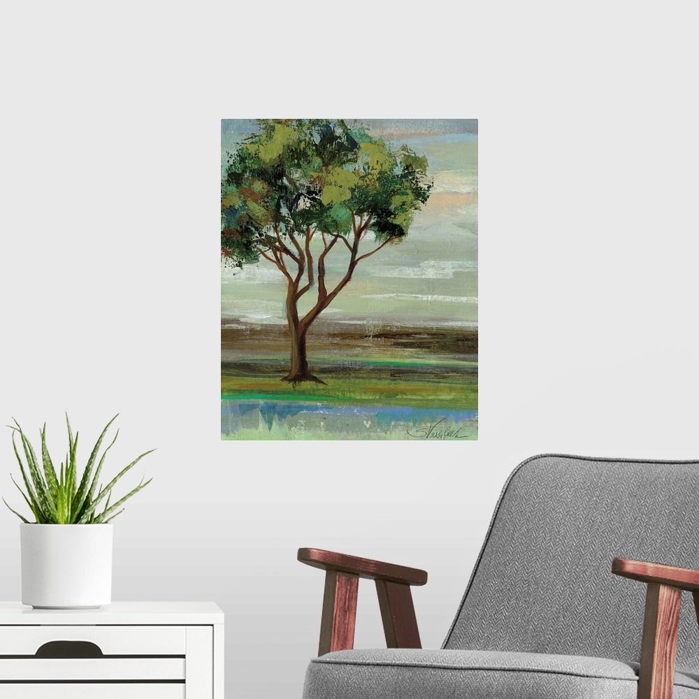 A modern room featuring Contemporary artwork of a tree with leafy green branches in a field.