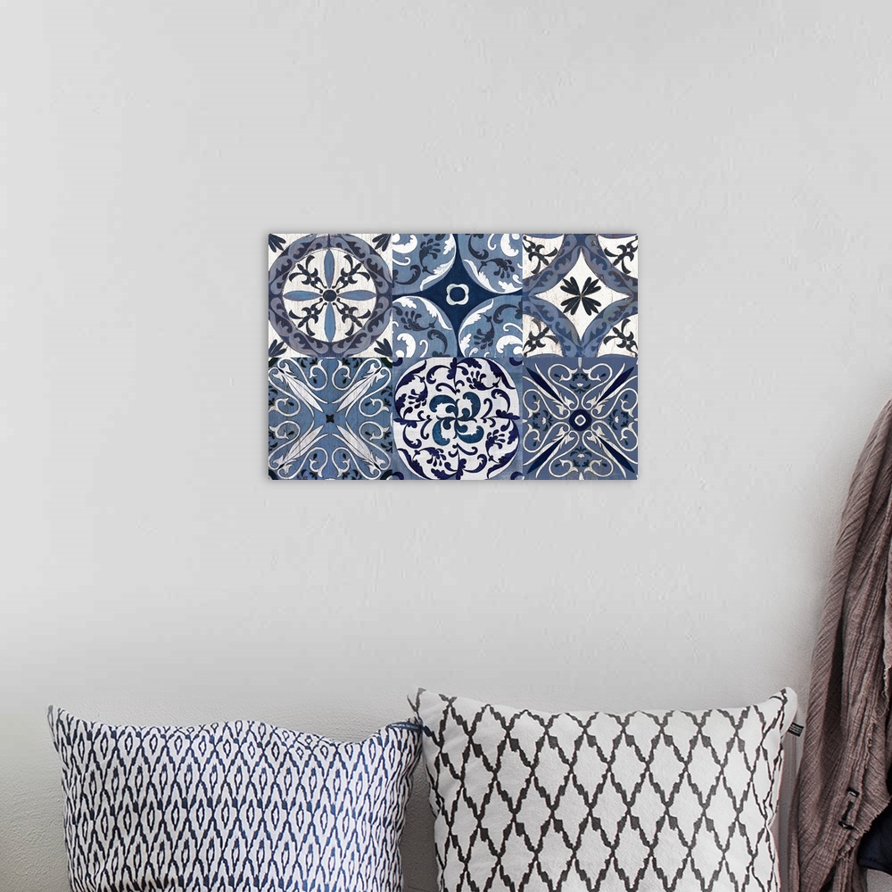 A bohemian room featuring Large contemporary painting of six square different tile-like designs in white and indigo.