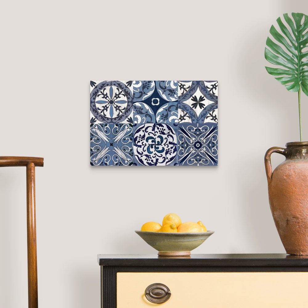 A traditional room featuring Large contemporary painting of six square different tile-like designs in white and indigo.