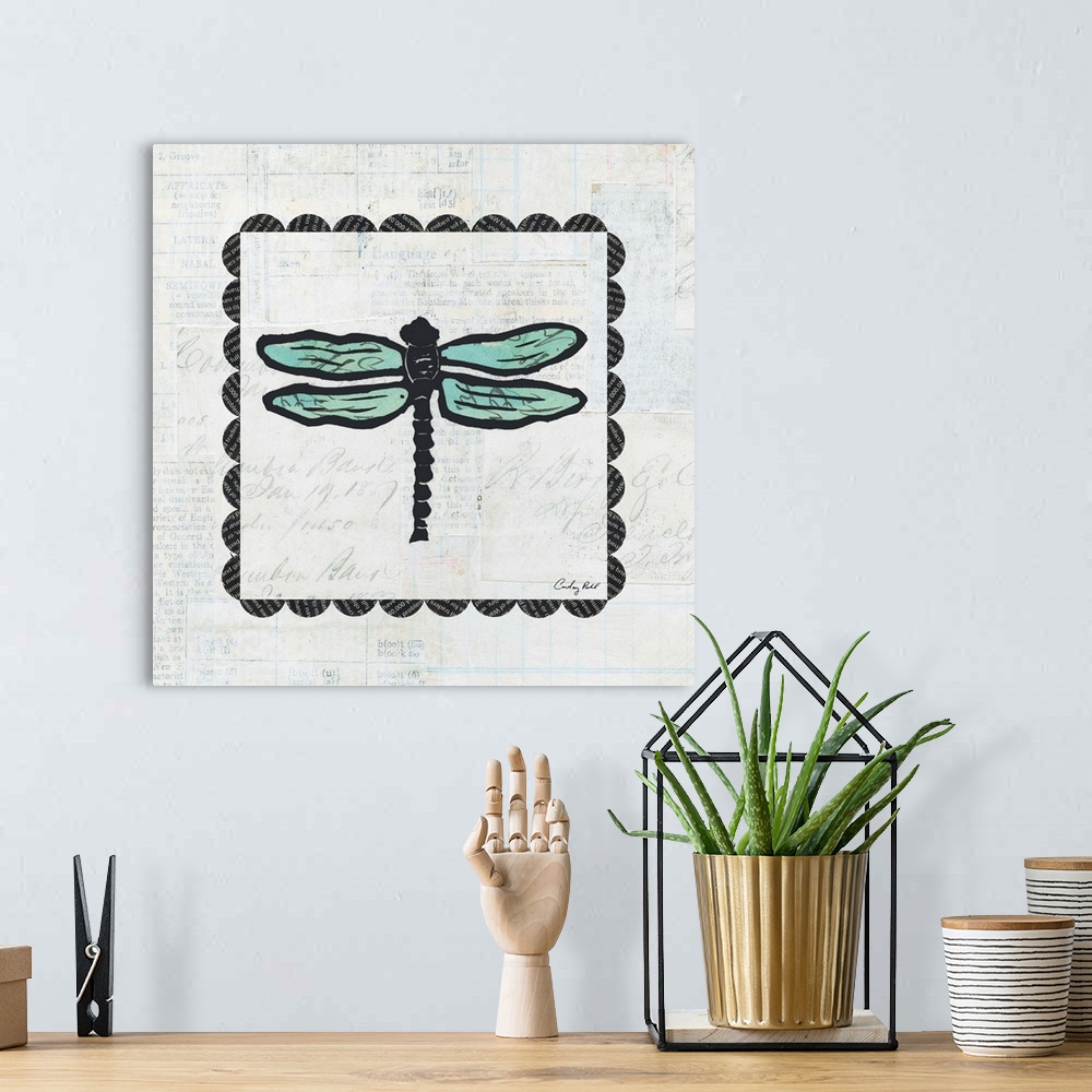 A bohemian room featuring Contemporary decorative artwork of a dragonfly surrounded by a square border design against a gra...