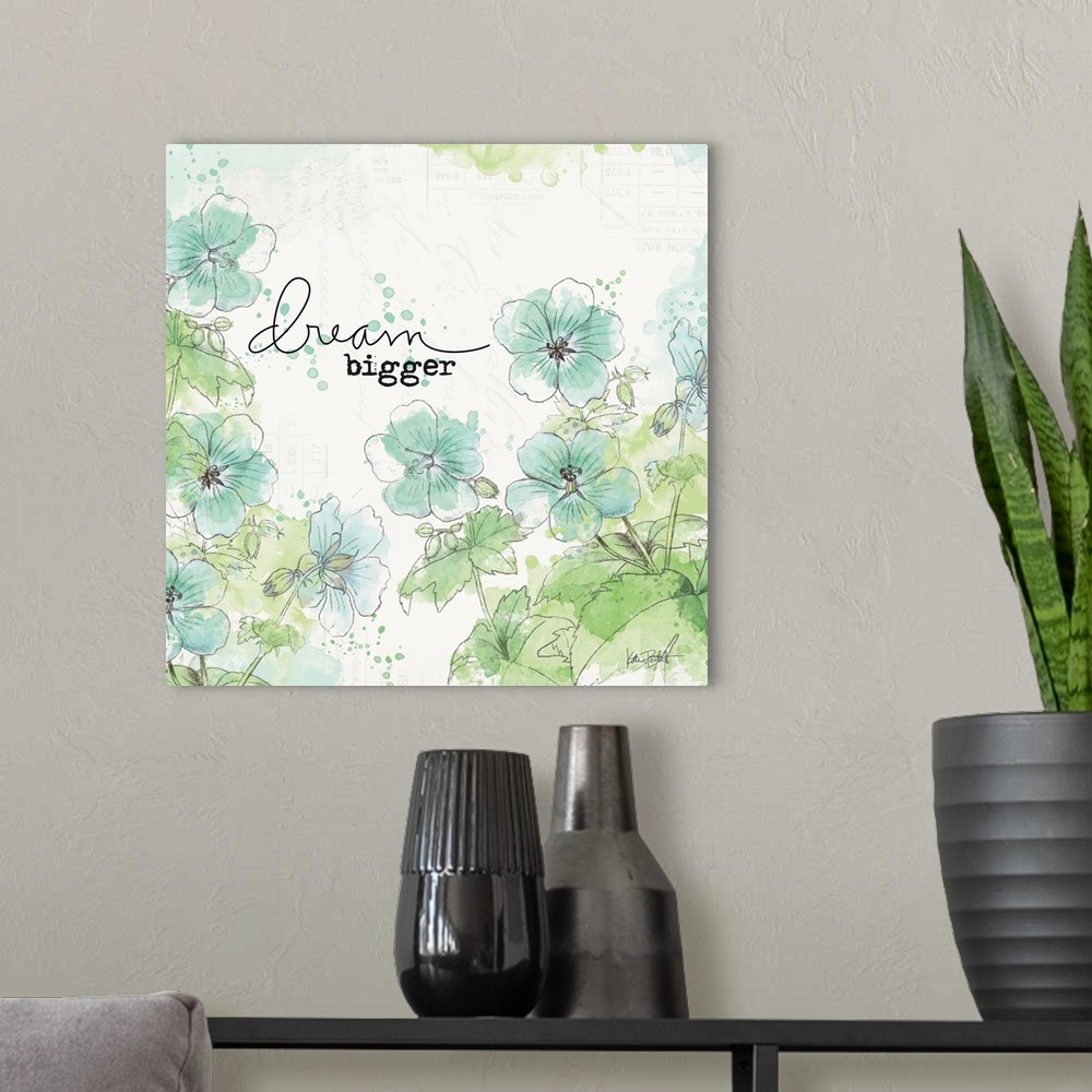 A modern room featuring "Dream Bigger" square art with illustrated blue and green flowers on a  white background with fai...