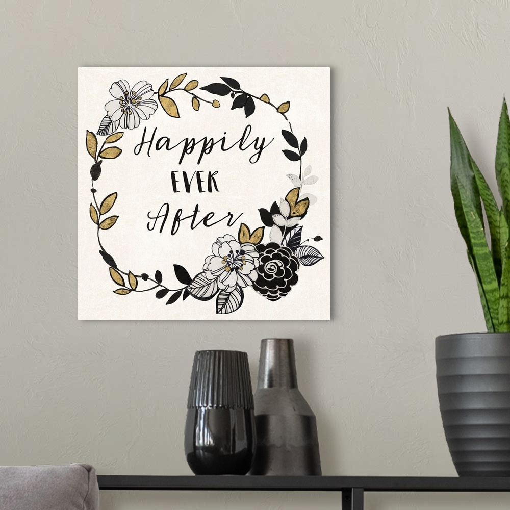 A modern room featuring "Happily Ever After" written inside a wreath with flowers in black, gold, and silver.