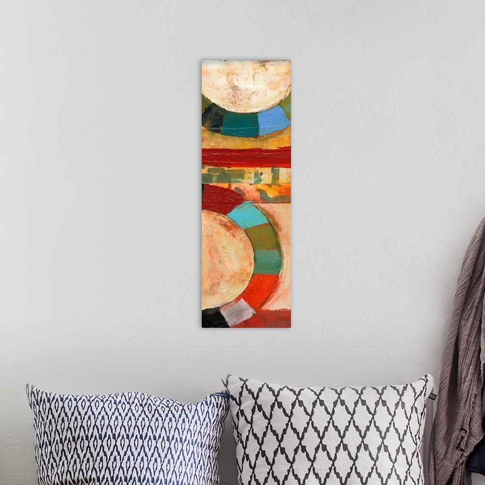 A bohemian room featuring Contemporary abstract painting featuring large rings of color in bright shades.