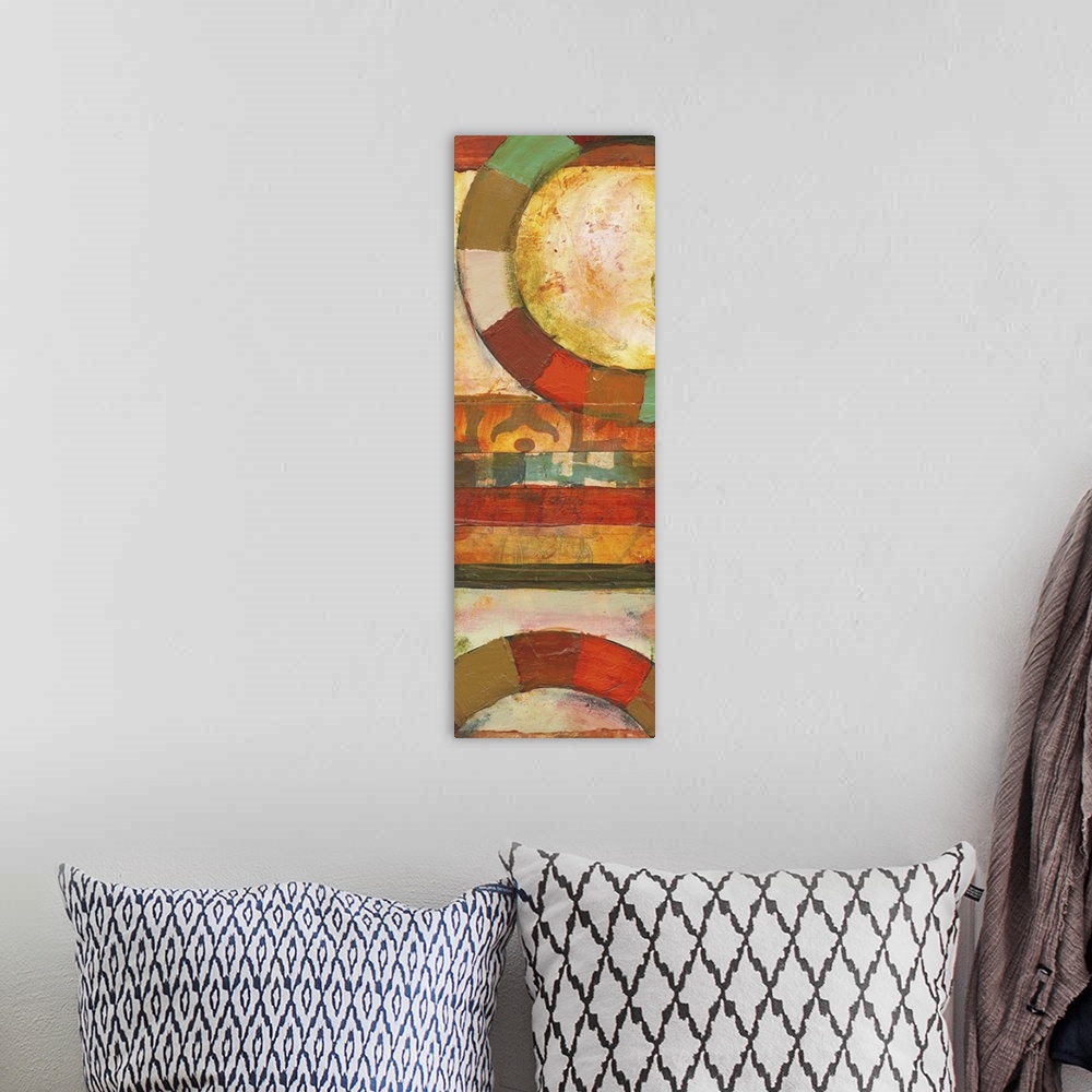A bohemian room featuring Contemporary abstract painting featuring large rings of color in bright shades.