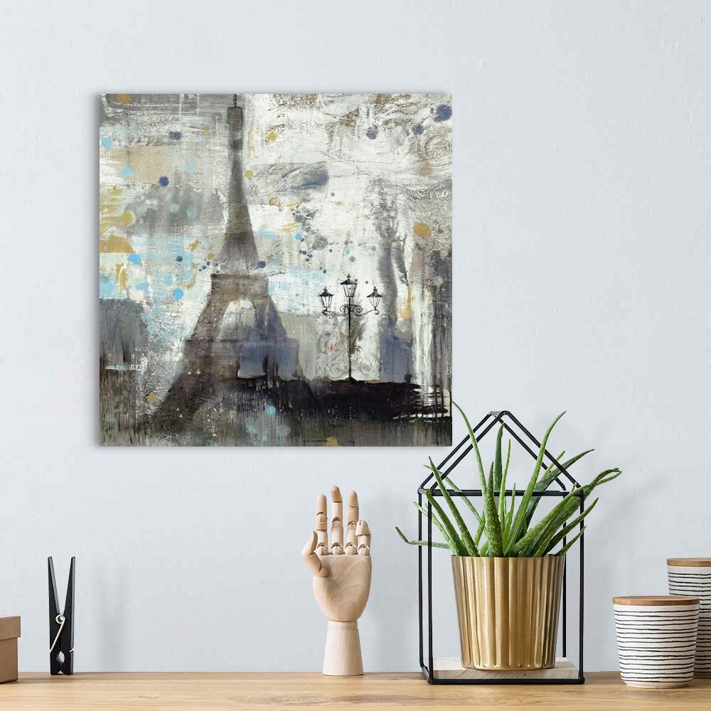 A bohemian room featuring Painting of the Eiffel Tower with abstract brushstrokes, in muted grey and blue colors.