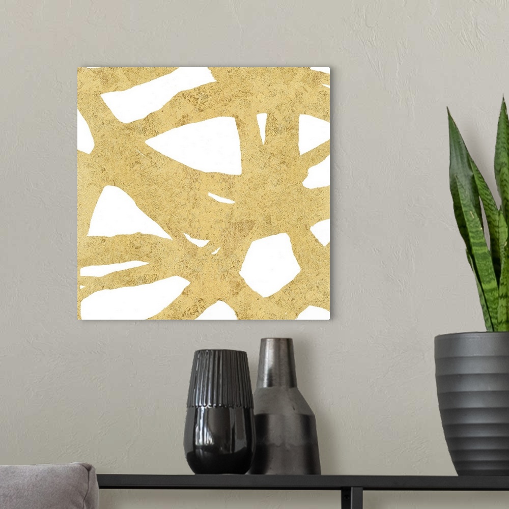 A modern room featuring Square abstract art with a gold webbed design on a white background.