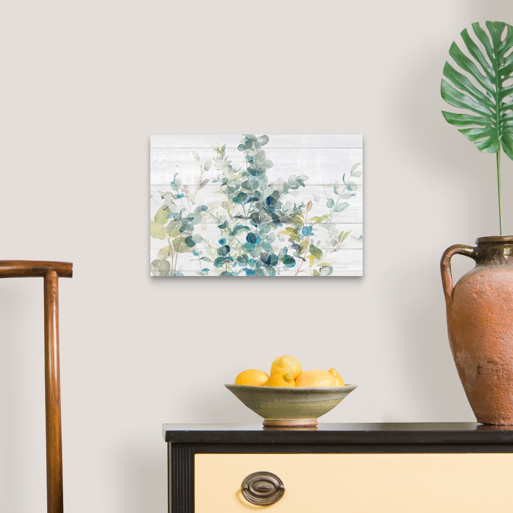 A traditional room featuring Decorative artwork featuring watercolor eucalyptus over shiplap.