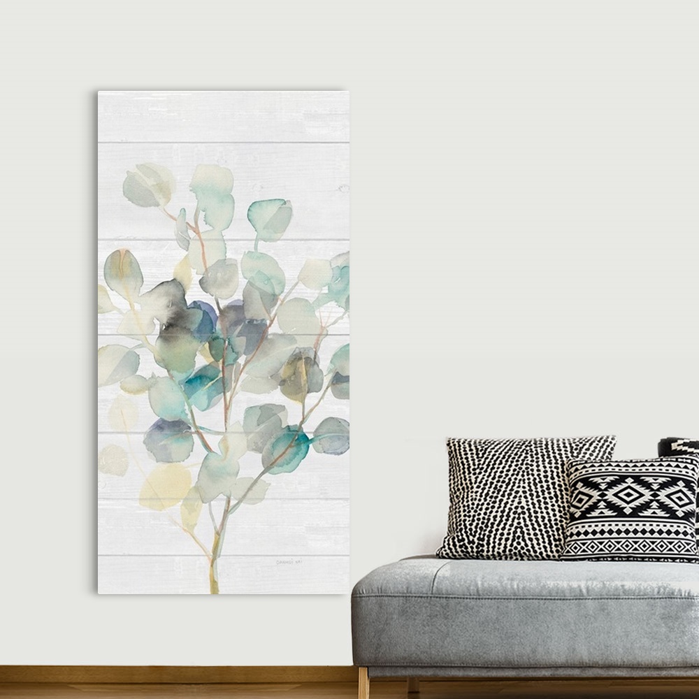 A bohemian room featuring Decorative artwork of watercolor eucalyptus leaves over a shiplap.