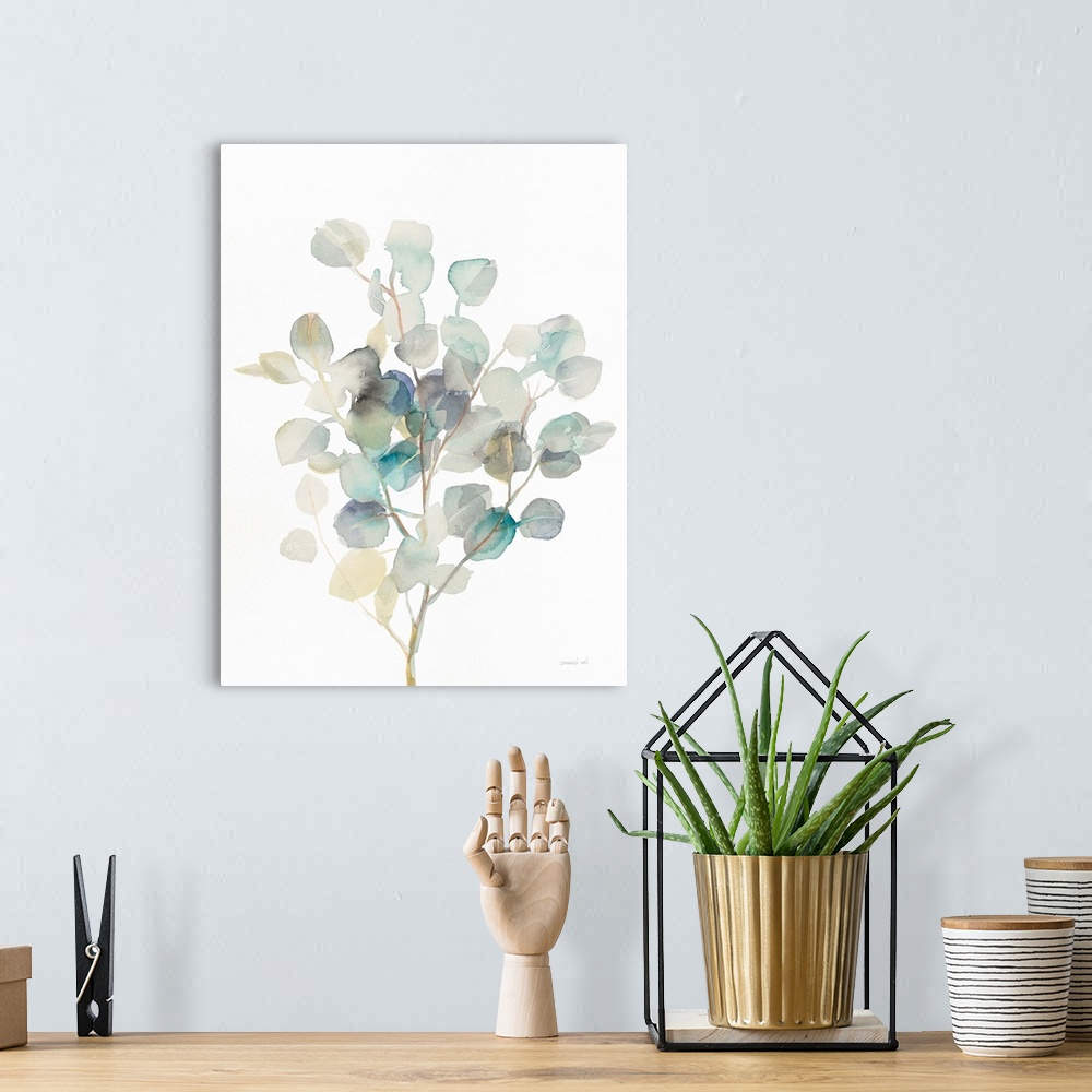 A bohemian room featuring Vertical watercolor painting of blue, green, gray, and yellow toned eucalyptus leaves on a white ...
