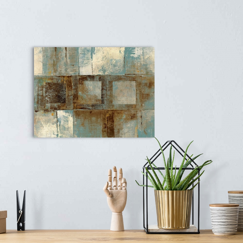 A bohemian room featuring Contemporary abstract painting of various grungy textured squares on a big canvas.
