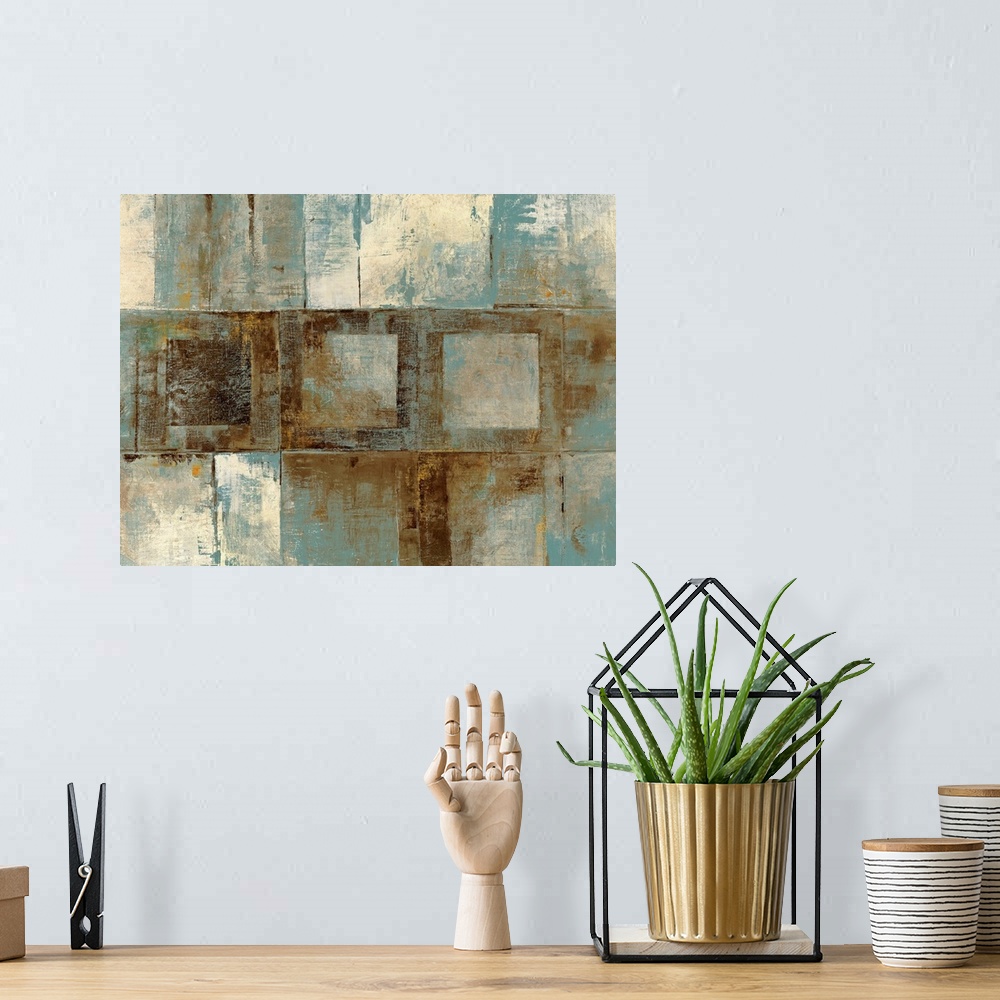 A bohemian room featuring Contemporary abstract painting of various grungy textured squares on a big canvas.