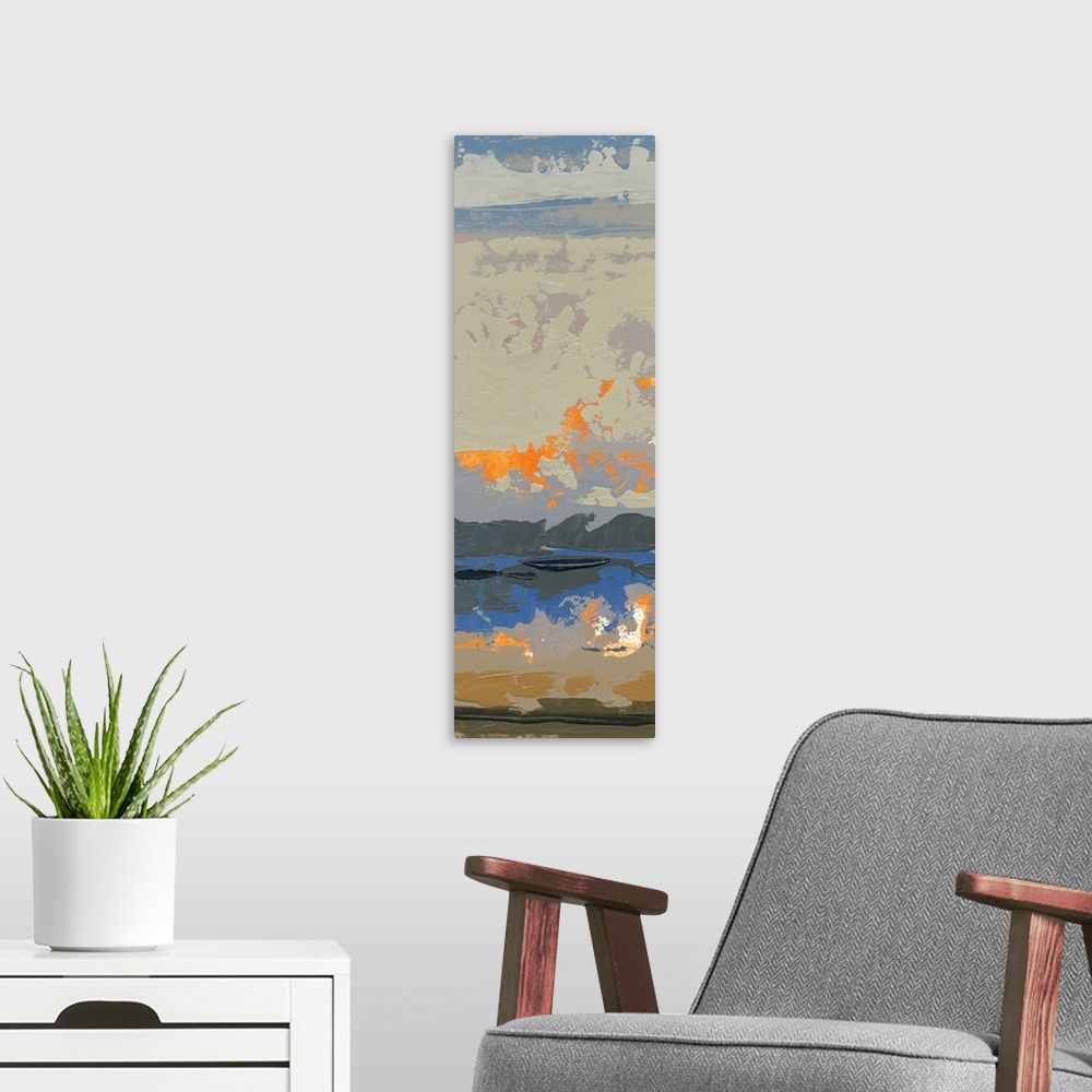 A modern room featuring Contemporary abstract artwork of vibrant oranges mottled against subdued cool colors.