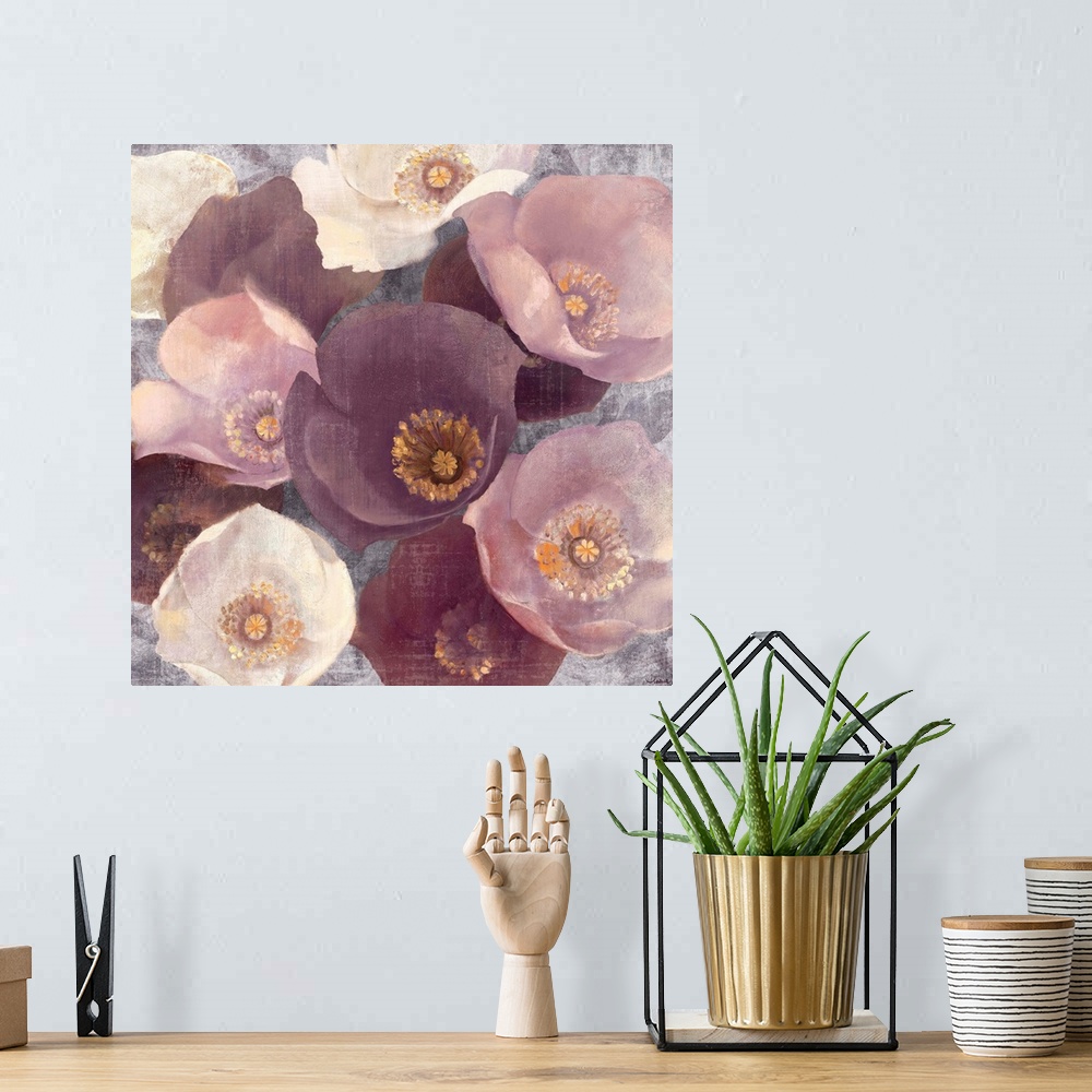 A bohemian room featuring Giant square floral artwork of a bunch of similar flowers in various colors, on a rough textured ...