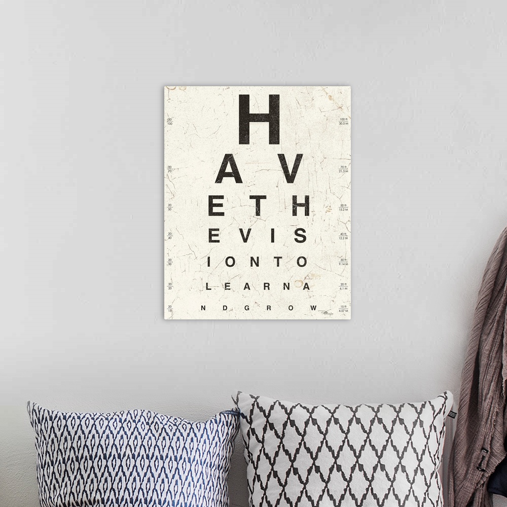 A bohemian room featuring Contemporary artwork of an eye exam chart spelling out an inspirational quote.