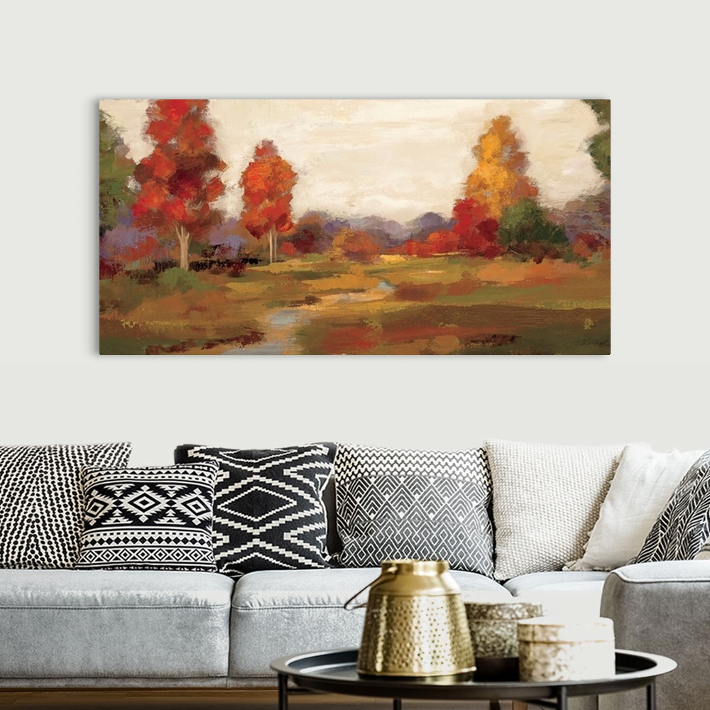 A bohemian room featuring Horizontal painting on a big canvas of a small creek bending through a large field, surrounded by...
