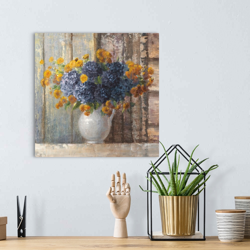 A bohemian room featuring A traditional contemporary painting of a white porcelain vase full of orange and blue flowers aga...