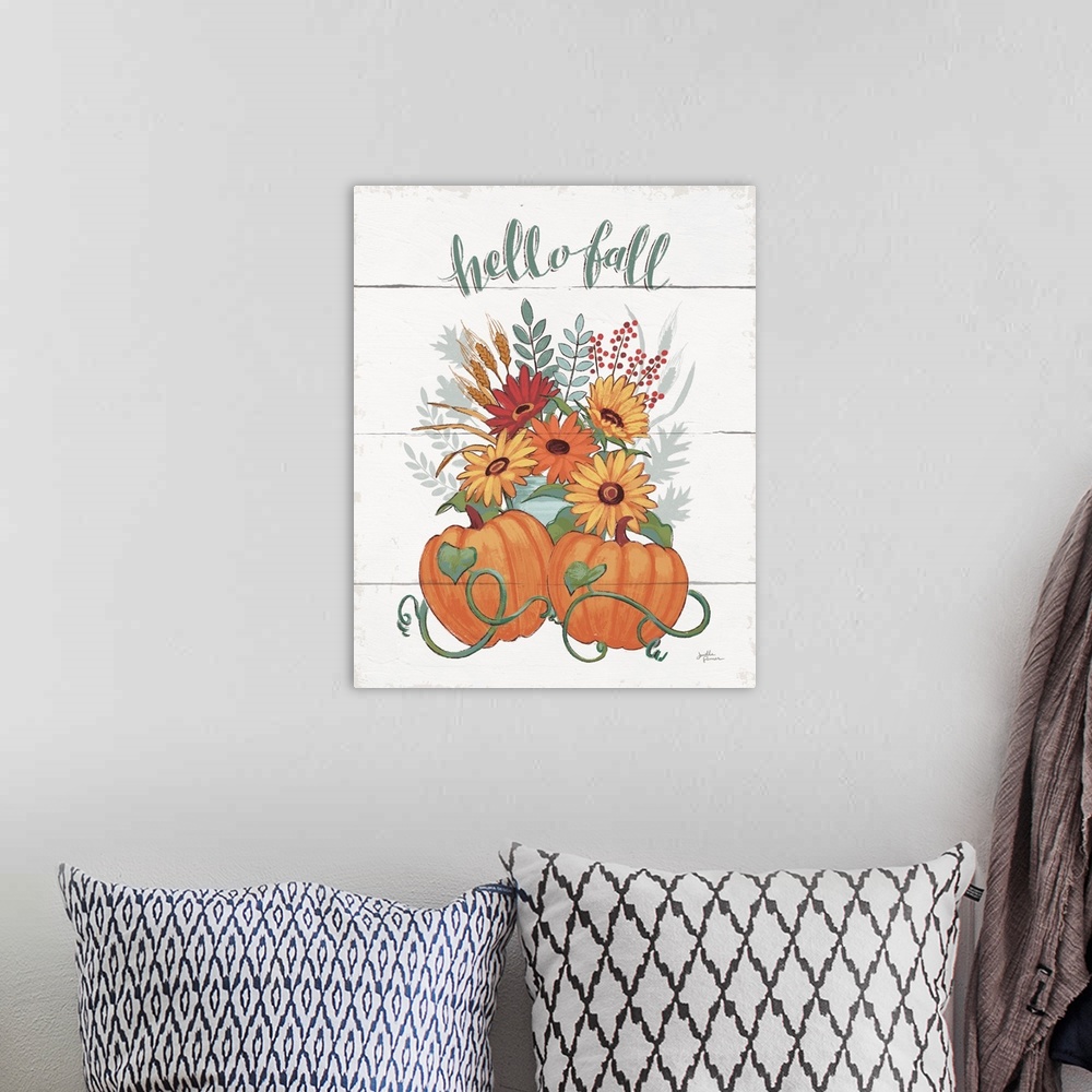 A bohemian room featuring "Hello Fall" with a pair of pumpkins and fall flowers on a white shiplap background.
