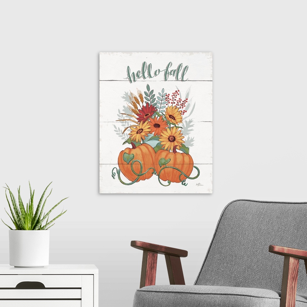 A modern room featuring "Hello Fall" with a pair of pumpkins and fall flowers on a white shiplap background.