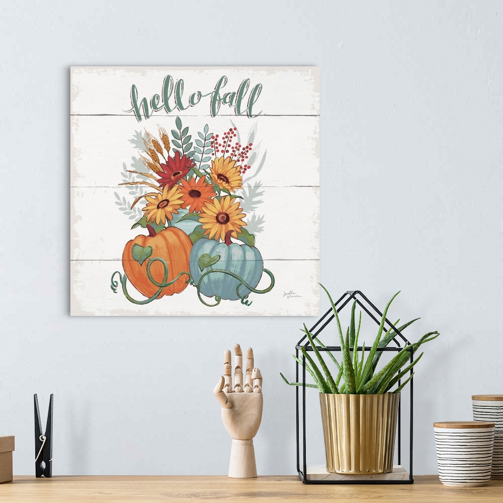 A bohemian room featuring Decorative artwork of the words "Hello Fall" above a bouquet of fall flowers with pumpkins and a ...