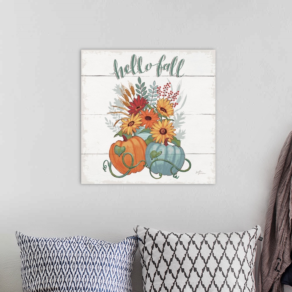 A bohemian room featuring Decorative artwork of the words "Hello Fall" above a bouquet of fall flowers with pumpkins and a ...