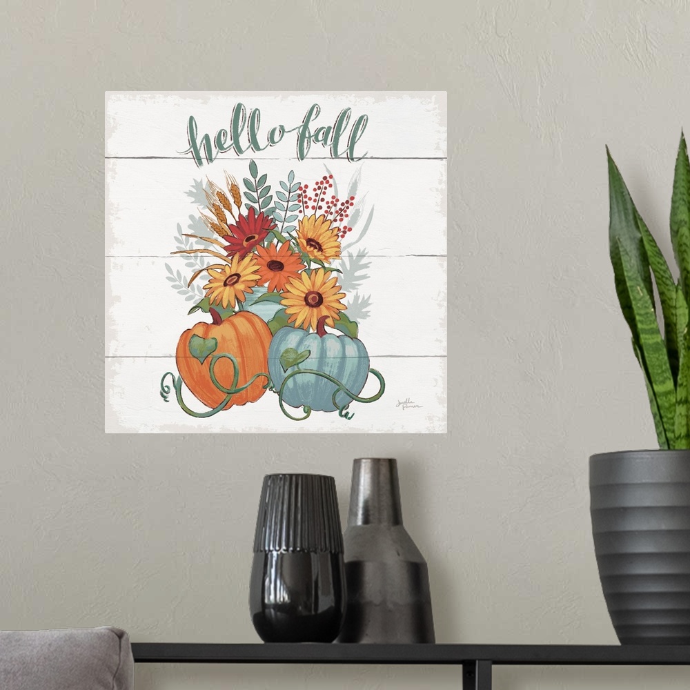 A modern room featuring Decorative artwork of the words "Hello Fall" above a bouquet of fall flowers with pumpkins and a ...