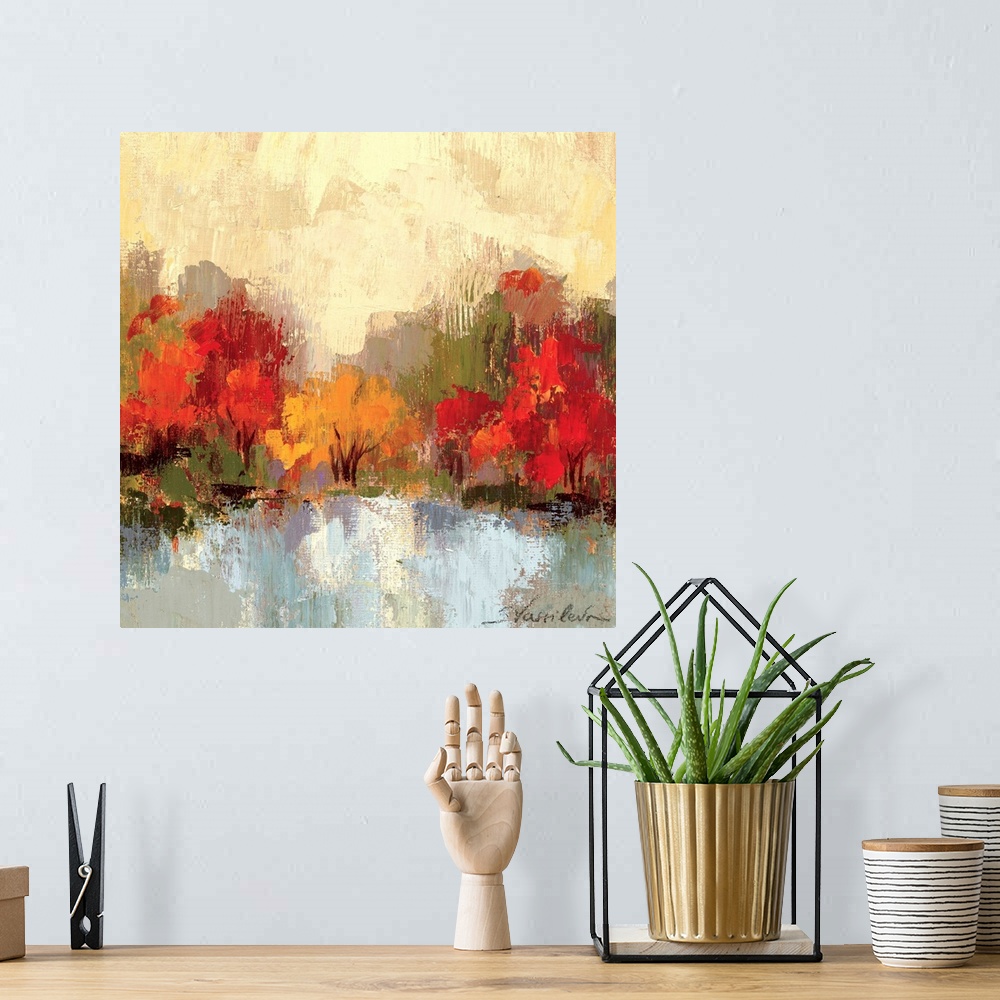 A bohemian room featuring Large colorful artwork of autumn trees with a cream painted sky and cool toned water in front of ...