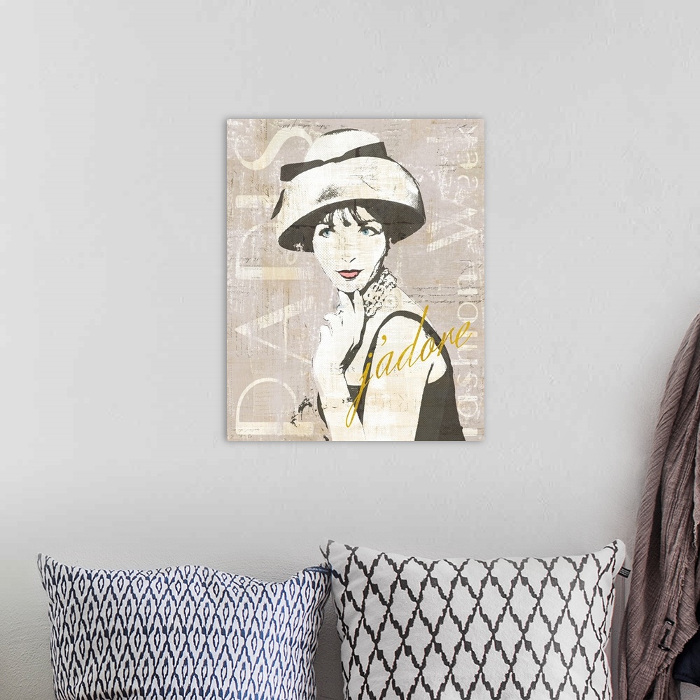 A bohemian room featuring Paris Fashion Week collage in gray, black, and white with "j'adore" written in gold a sparkle font.