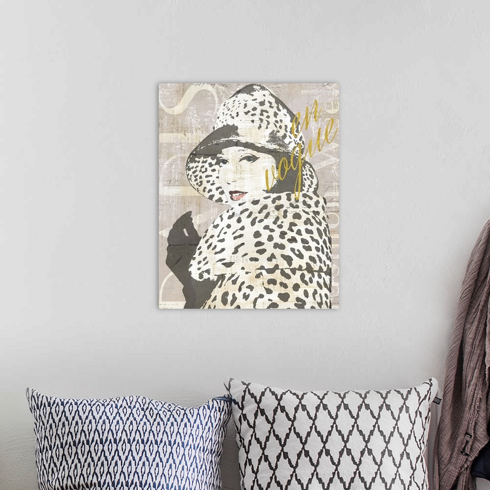 A bohemian room featuring Paris Fashion Week collage in gray, black, and white with "en vogue" written in gold a sparkle font.