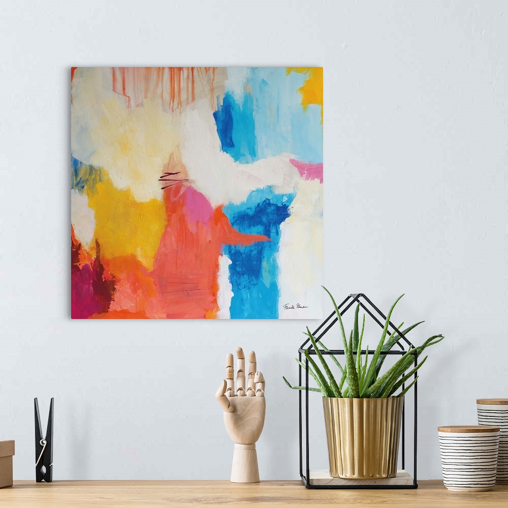 A bohemian room featuring A square abstract painting in bright colors of blue, yellow and red.
