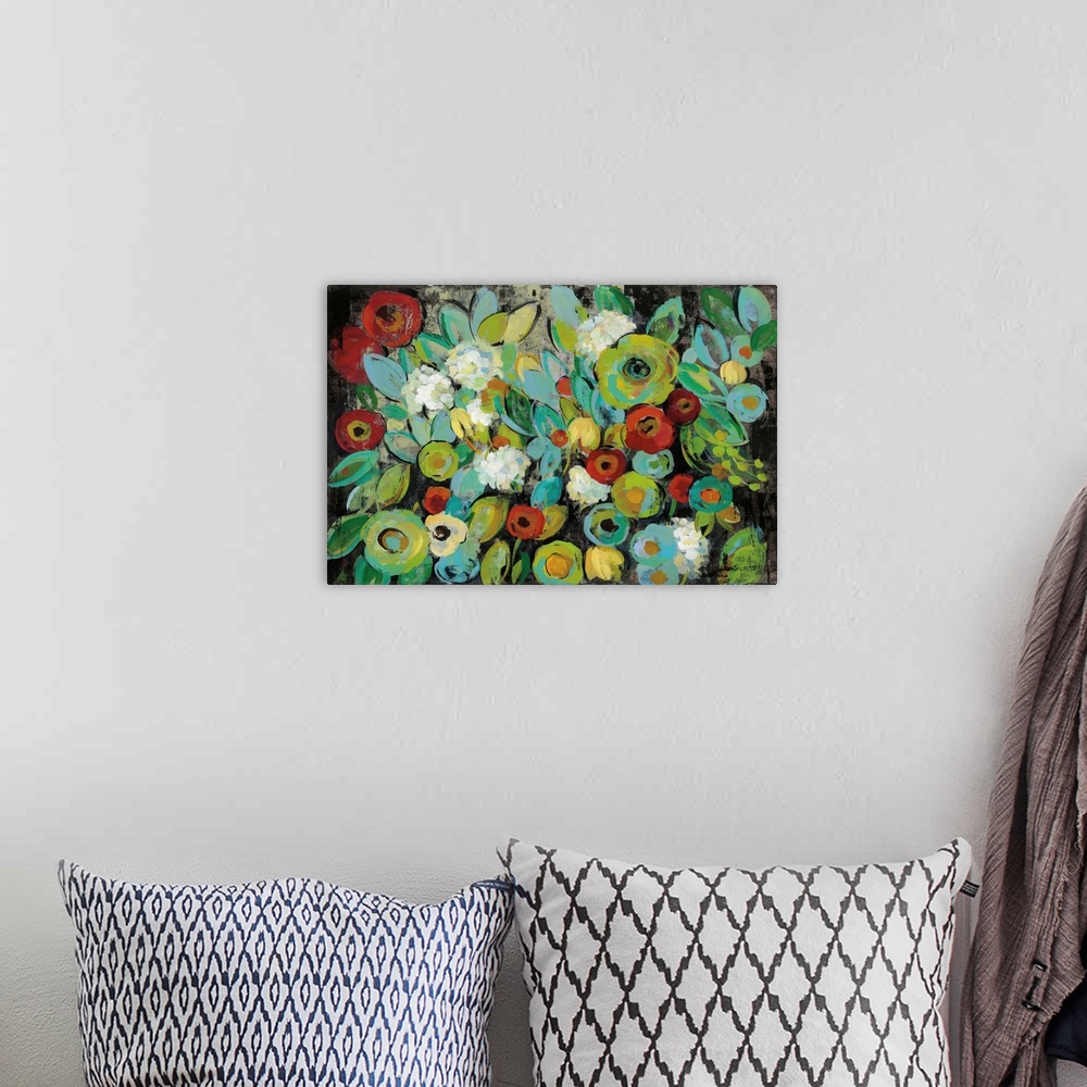 A bohemian room featuring Contemporary floral abstract painting with bright colored flowers on a dark black background.