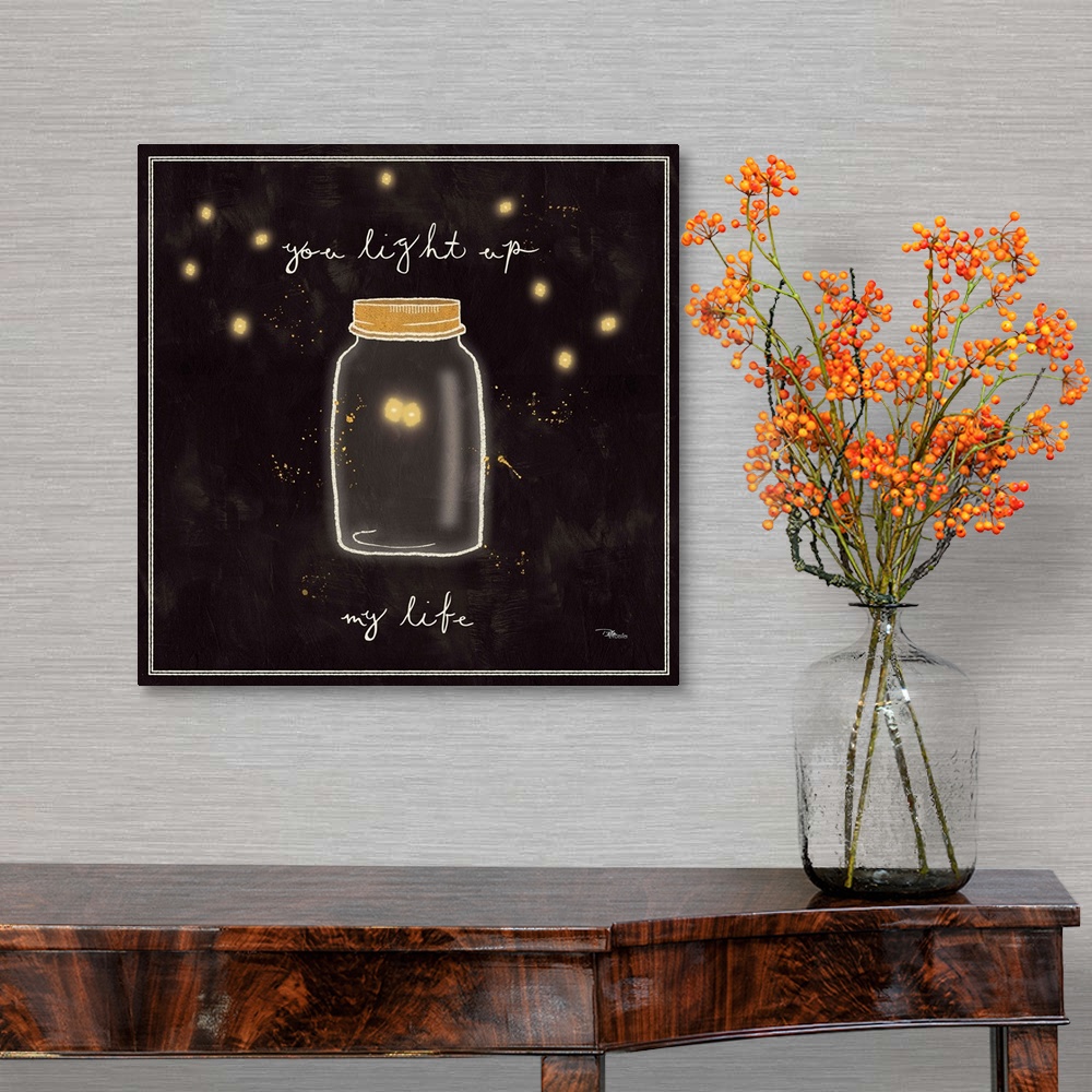 A traditional room featuring Decorative artwork of a mason jar with two fireflies inside and the phrase, "You light up my life."
