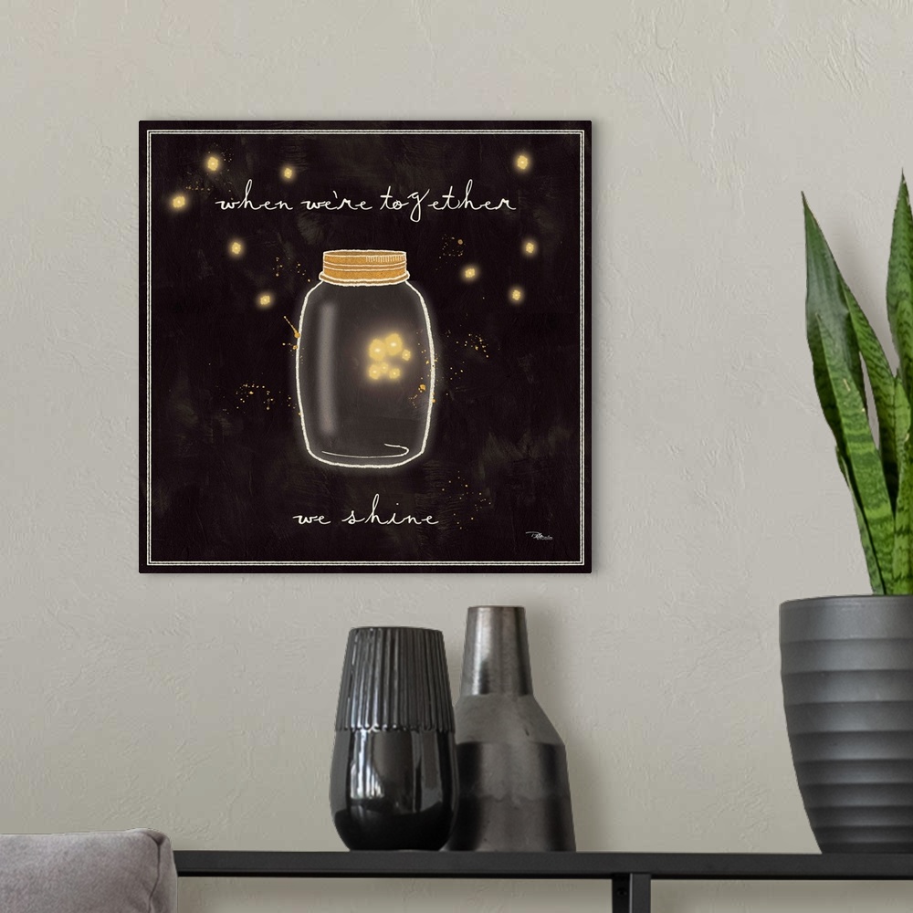 A modern room featuring Decorative artwork of a mason jar with a family of fireflies inside and the phrase, "When we're t...
