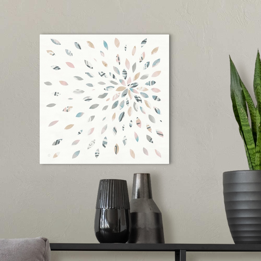 A modern room featuring Square watercolor painting with oblong shaped pieces creating a starburst firework design.