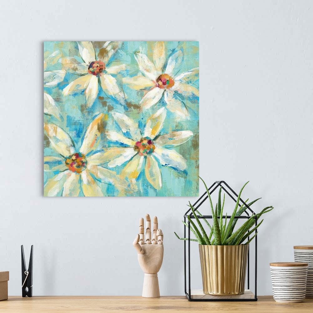 A bohemian room featuring Contemporary painting of white flowers against a light blue background.