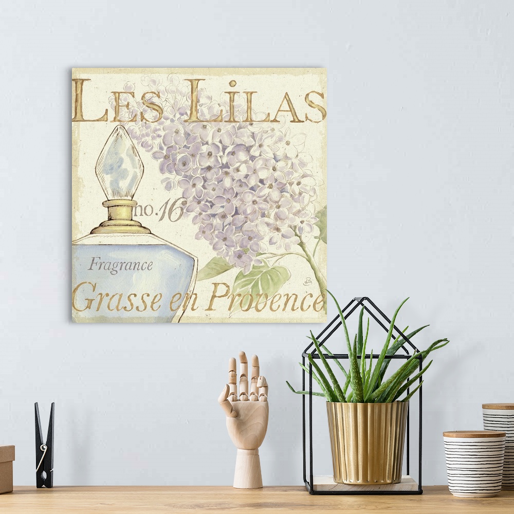 A bohemian room featuring Contemporary artwork of a perfume bottle close in frame, with a flower to the right and text in t...