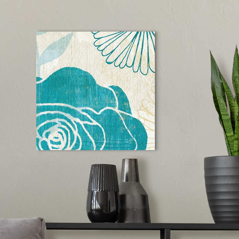 A modern room featuring Contemporary artwork of big brightly colored flowers on an earthy neutral toned background.