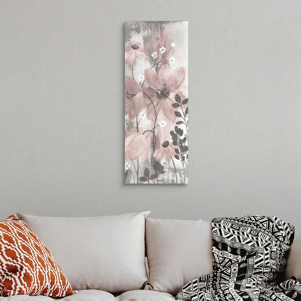 A bohemian room featuring Contemporary artwork of pink flowers over a distressed gray background.