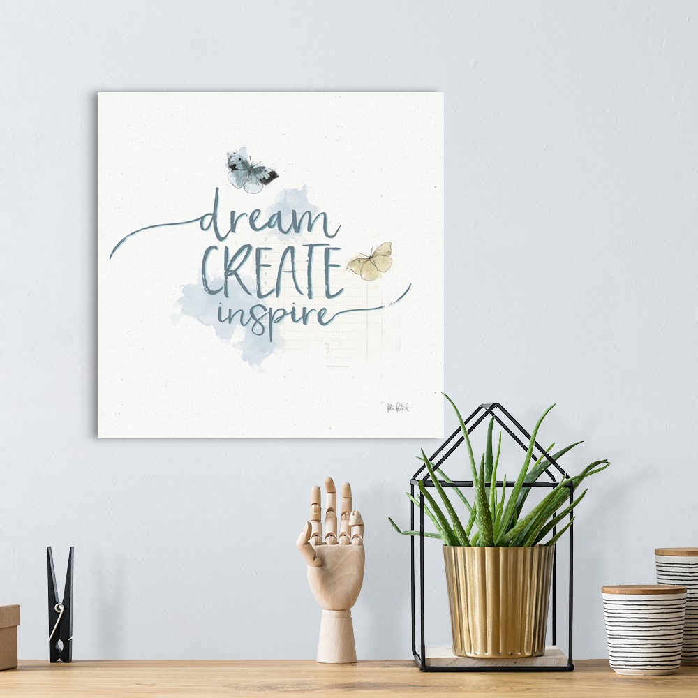 A bohemian room featuring "Dream Create Inspire" written in blue with watercolor butterflies on a textured white background.