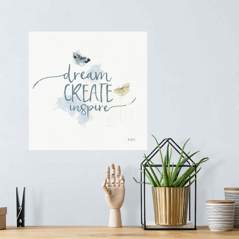 A bohemian room featuring "Dream Create Inspire" written in blue with watercolor butterflies on a textured white background.