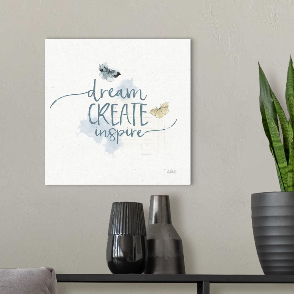 A modern room featuring "Dream Create Inspire" written in blue with watercolor butterflies on a textured white background.