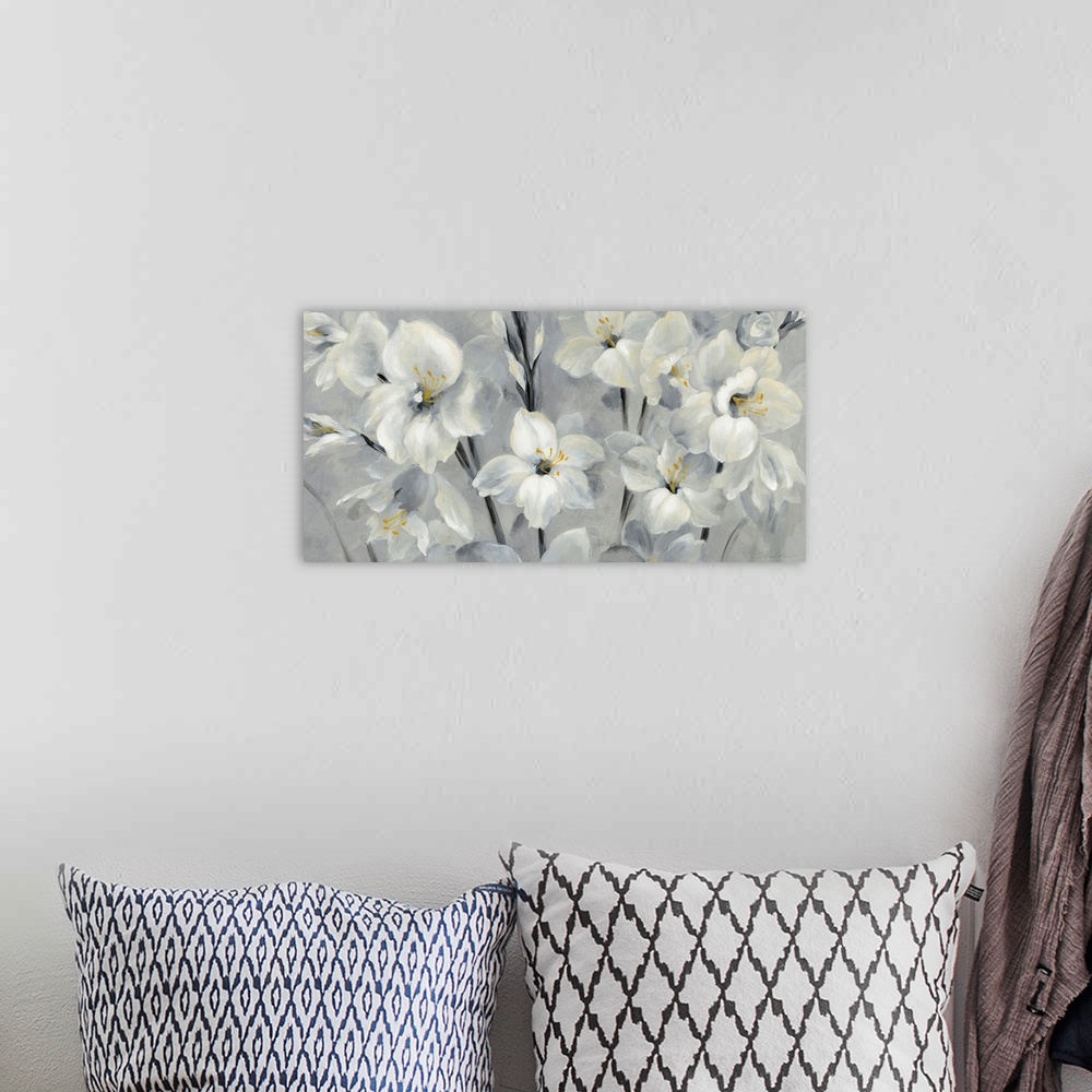 A bohemian room featuring Contemporary painting of white flowers with golden centers on a grey toned background.