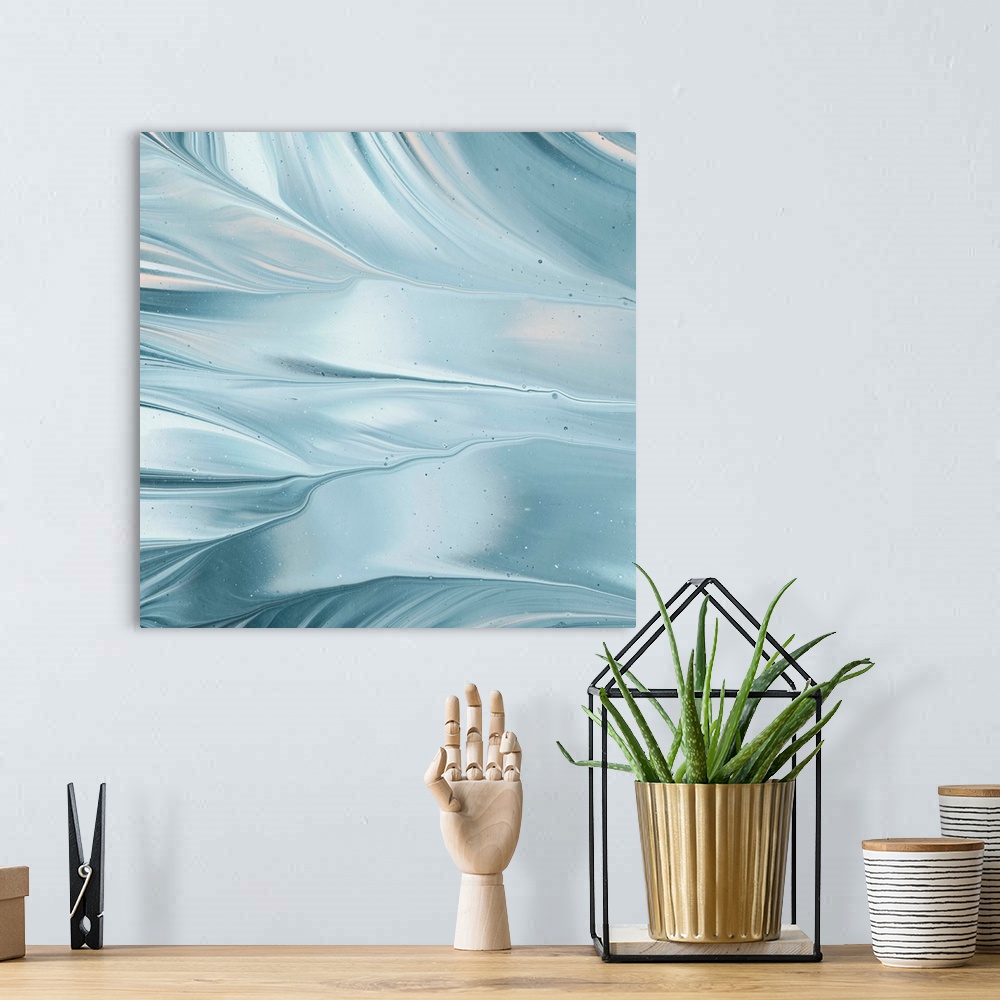 A bohemian room featuring Square abstract painting of blue and white marbling with hints of pink, creating movement and flo...