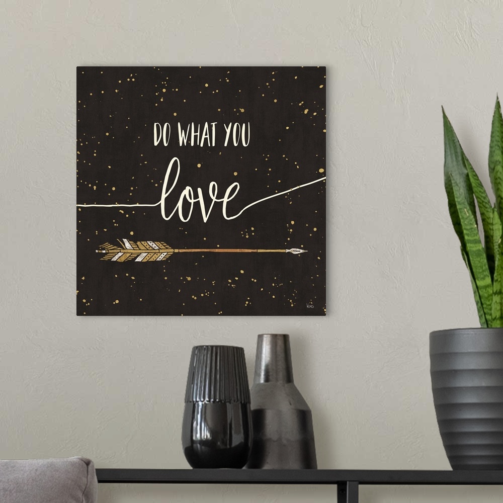 A modern room featuring "Do What You Love" written in white on a black background with metallic gold paint splatter and a...