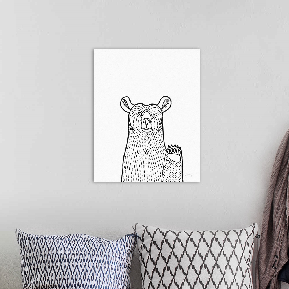 A bohemian room featuring A black and white illustration of a bear on a textured white background.