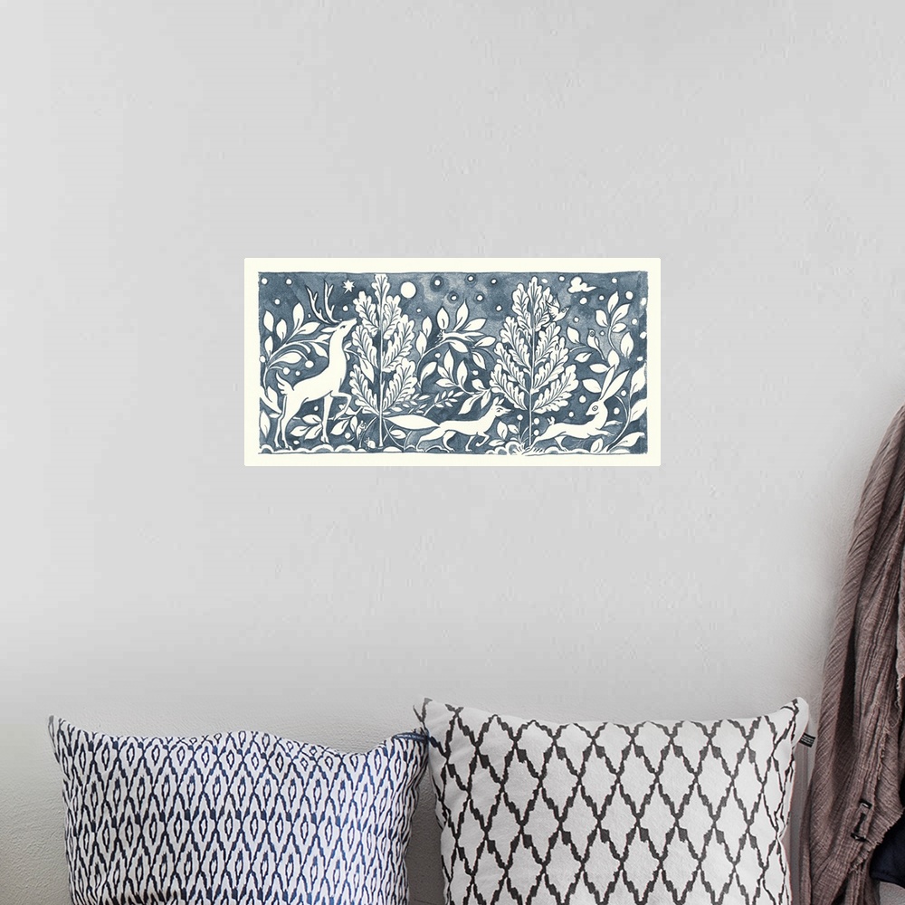A bohemian room featuring Floral indigo and white watercolor painting with woodland creatures in a wooded scene.
