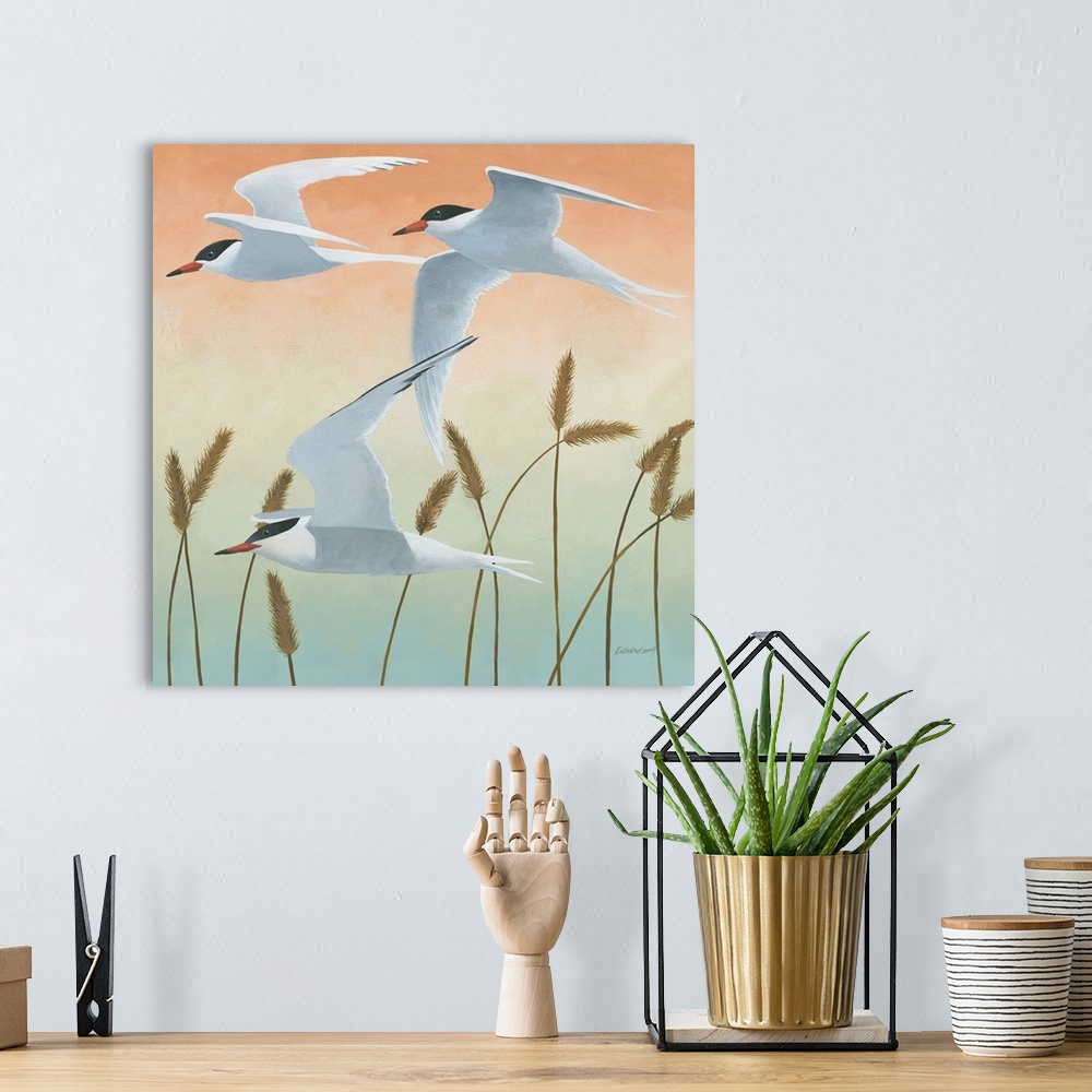 A bohemian room featuring Square painting of three sea birds in flight over tall sea grass with an orange, yellow, green, a...