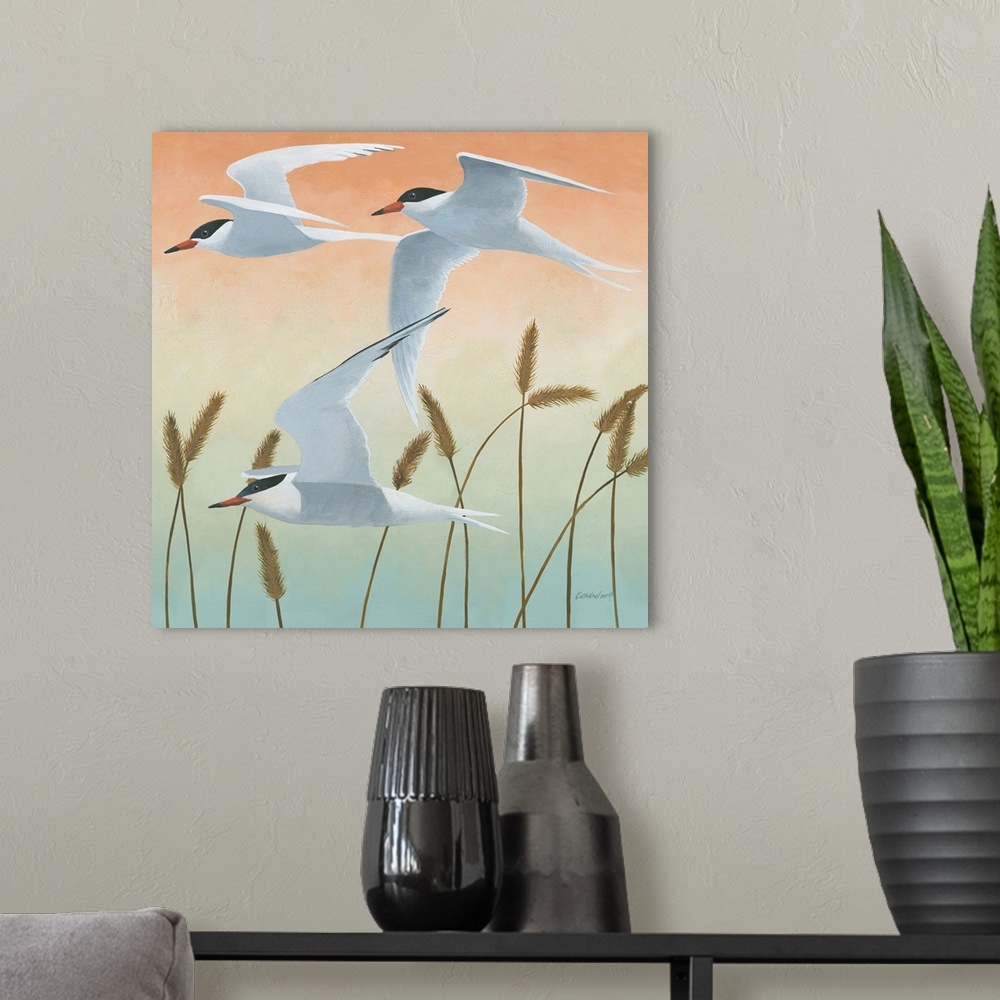 A modern room featuring Square painting of three sea birds in flight over tall sea grass with an orange, yellow, green, a...